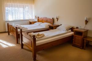 A bed or beds in a room at Pri Ani Guest House