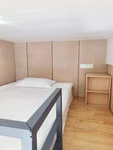 Voodi või voodid majutusasutuse Yue Lv Hotel toas