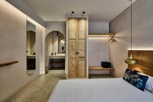 Voodi või voodid majutusasutuse Ios Resort toas