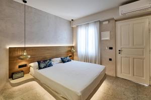 Voodi või voodid majutusasutuse Ios Resort toas