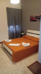 A bed or beds in a room at B&B RESTO AL SUD