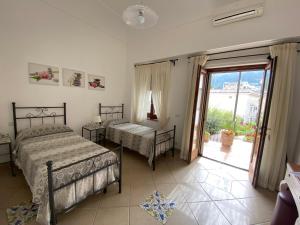 Postel nebo postele na pokoji v ubytování B&B Il Vicolo