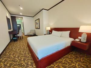Postel nebo postele na pokoji v ubytování Riviera Suites Melaka + 37 fotografií