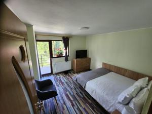 Postel nebo postele na pokoji v ubytování Vila Monica