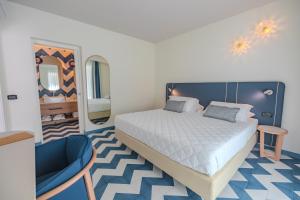 Posteľ alebo postele v izbe v ubytovaní Tuscany Hotel Alle Dune