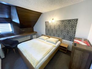 Postel nebo postele na pokoji v ubytování Reich Motel + 8 fotografií