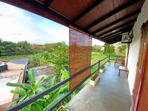 a balcony of a house with a view at Hotel Vish Ceylon in Talawatugoda
