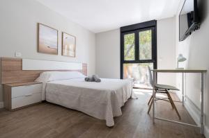 Katil atau katil-katil dalam bilik di Acogedor Refugio con Terraza