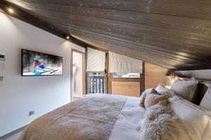 Postel nebo postele na pokoji v ubytování Chalet Clara Megeve