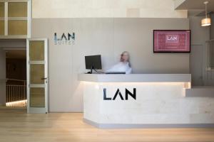a woman sitting at a desk in a law office at LAN Suites Antilla Playa in La Antilla +56 photos