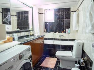 a bathroom with a washing machine and a sink at Rena's House in Ierapetra +12 photos