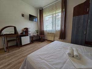 Postel nebo postele na pokoji v ubytování Vila Eliade
