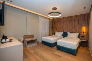 Ліжко або ліжка в номері Hotel Mozart