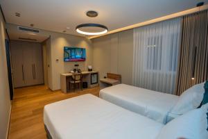 Ліжко або ліжка в номері Hotel Mozart