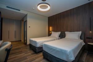 Ліжко або ліжка в номері Hotel Mozart