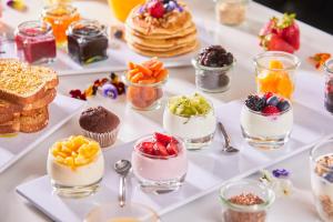 a buffet of desserts and pastries on a table at Hotel Astoria Playa Adults Only 4* Sup in Port d'Alcudia