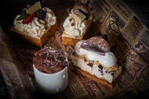 a plate of pastries and a drink on a table at Hotel Astoria Playa Adults Only 4* Sup in Port d'Alcudia