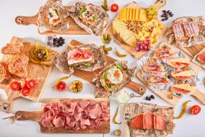a table filled with lots of different types of food at Hotel Astoria Playa Adults Only 4* Sup in Port d'Alcudia