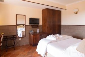 Voodi või voodid majutusasutuse SarAnd Relais-Adults Only toas