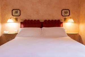 Voodi või voodid majutusasutuse SarAnd Relais-Adults Only toas