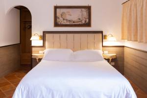 Voodi või voodid majutusasutuse SarAnd Relais-Adults Only toas