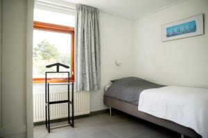 Postel nebo postele na pokoji v ubytování Theijwerck - Ouddorp NOT INTENDED FOR COMPANY OR WORK-RELATED STAYS