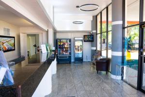 a lobby of a store with a blue door at Howard Johnson by Wyndham Clearwater - Dunedin in Clearwater