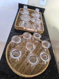 a tray of wine glasses sitting on a table at Apartamento completo in Montes Claros