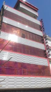 a building with red and white tile on it at RAJHAT MARANAO House in Bodh Gaya +19 photos