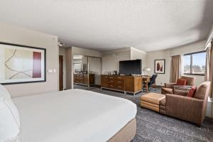 a large hotel room with a bed and a television at DoubleTree by Hilton Spokane City Center in Spokane