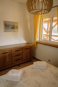 a bedroom with a bed and a window at Ostoja nad Gilem in Ostrów Wielki +88 photos
