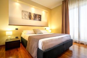 Postel nebo postele na pokoji v ubytování Garden Hotel