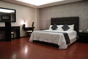 Voodi või voodid majutusasutuse Wyndham Garden Aguascalientes Hotel & Casino toas
