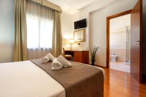 Postel nebo postele na pokoji v ubytování Garden Hotel