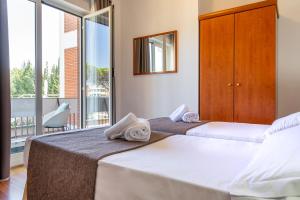 Postel nebo postele na pokoji v ubytování Garden Hotel