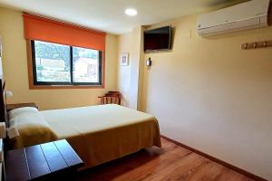 Postel nebo postele na pokoji v ubytování Apartamentos Ababides + 39 fotografií