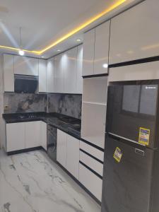 Η κουζίνα ή μικρή κουζίνα στο Appartement proche de la plage +6 φωτογραφίες
