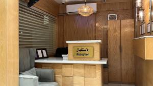 an office with a reception desk with a box on it at شقق وافي حائل للشقق المخدومة إقتصادي in Hail