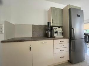 Kuchyň nebo kuchyňský kout v ubytování Karo`s Apartment