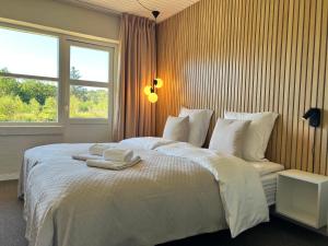 Letto o letti in una camera di Strandhotel Klitrosen