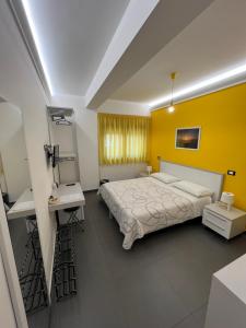 A bed or beds in a room at Sicilia Bedda B&B