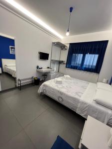 A bed or beds in a room at Sicilia Bedda B&B