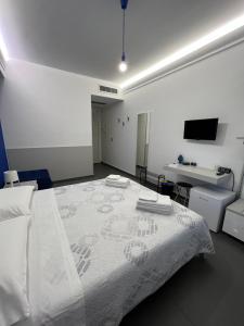 A bed or beds in a room at Sicilia Bedda B&B