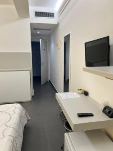 A television and/or entertainment centre at Sicilia Bedda B&B