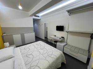 A bed or beds in a room at Sicilia Bedda B&B