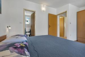 Posteľ alebo postele v izbe v ubytovaní Apartman KLARA 2