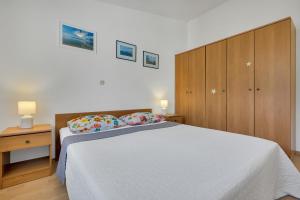 Posteľ alebo postele v izbe v ubytovaní Apartman KLARA 2