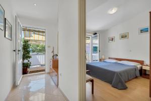 Posteľ alebo postele v izbe v ubytovaní Apartman KLARA 2