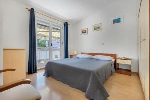 Posteľ alebo postele v izbe v ubytovaní Apartman KLARA 2