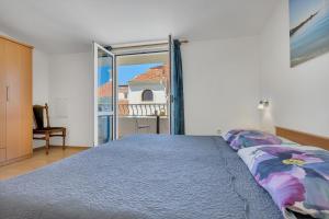 Posteľ alebo postele v izbe v ubytovaní Apartman KLARA 2